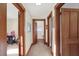 Hallway with carpet, wood trim, and doors to other rooms at 621 N State St, Greenfield, IN 46140