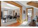 Bright entryway with hardwood floors and view into office space at 621 N State St, Greenfield, IN 46140