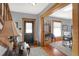 Entryway with hardwood floors, a black door, and a staircase at 621 N State St, Greenfield, IN 46140