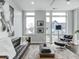 Bright and airy living room with large windows and a modern aesthetic at 319 E 16Th St # 202, Indianapolis, IN 46202