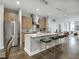 Open concept kitchen with island and stainless steel appliances at 319 E 16Th St # 202, Indianapolis, IN 46202