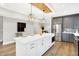 Modern kitchen with white cabinets, stainless steel appliances, and quartz countertops at 2003 Central Ave, Indianapolis, IN 46202