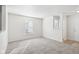 Living room with grey carpet, neutral walls, and a window at 1738 Sonesta Way, Indianapolis, IN 46217