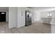 Kitchen with stainless steel refrigerator and white cabinets at 7308 Forest Park Dr, Indianapolis, IN 46217