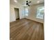 Bright bedroom with hardwood floors and a ceiling fan at 217 N Temple Ave, Indianapolis, IN 46201