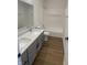 Double vanity bathroom with a shower/tub combo at 217 N Temple Ave, Indianapolis, IN 46201
