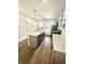 Modern kitchen with gray cabinets and island at 217 N Temple Ave, Indianapolis, IN 46201