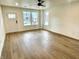Spacious living room with light wood flooring at 217 N Temple Ave, Indianapolis, IN 46201