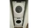 Stackable Whirlpool washer and dryer in a closet at 217 N Temple Ave, Indianapolis, IN 46201