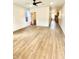 Spacious living room with hardwood floors and a ceiling fan at 217 N Temple Ave, Indianapolis, IN 46201