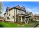 View of the home's side and beautifully landscaped yard at 1507 Broadway St, Indianapolis, IN 46202
