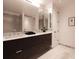 Modern bathroom with double vanity and sleek dark wood cabinets at 855 N East St # 303-B, Indianapolis, IN 46202