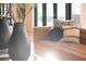 Beige velvet sofa with black and white striped pillows at 855 N East St # 303-B, Indianapolis, IN 46202