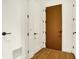 Clean entryway with wood floors and neutral walls at 855 N East St # 303-B, Indianapolis, IN 46202