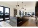 Modern kitchen with island, stainless steel appliances, and access to a deck at 855 N East St # 303-B, Indianapolis, IN 46202