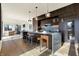 Modern kitchen with dark wood cabinetry, a large island, and stainless steel appliances at 855 N East St # 303-B, Indianapolis, IN 46202