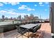 Enjoy city views from this rooftop deck, complete with dining furniture at 855 N East St # 303-B, Indianapolis, IN 46202