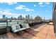 Spacious rooftop deck with city views and comfortable seating at 855 N East St # 303-B, Indianapolis, IN 46202