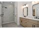 Elegant bathroom with double vanity, marble shower, and modern fixtures at 6621 Flowstone Way, Indianapolis, IN 46237