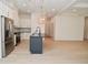Open concept kitchen with island and stainless steel appliances at 6621 Flowstone Way, Indianapolis, IN 46237