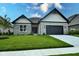 Craftsman style home with stone accents and a 2-car garage at 6621 Flowstone Way, Indianapolis, IN 46237
