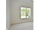 Bright bedroom with large window and carpet flooring at 6621 Flowstone Way, Indianapolis, IN 46237