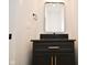Stylish bathroom with dark vanity and gold accents at 6621 Flowstone Way, Indianapolis, IN 46237