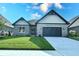 Modern home with stone and siding exterior at 6621 Flowstone Way, Indianapolis, IN 46237