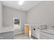 Bright laundry room featuring a sink and ample counter space at 4212 Stone Lake Dr, Zionsville, IN 46077