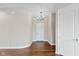 Entryway with hardwood floors, chandelier, and white doors at 4212 Stone Lake Dr, Zionsville, IN 46077