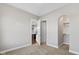 Well-lit bedroom with a view of the kitchen and walk-in closet at 4212 Stone Lake Dr, Zionsville, IN 46077