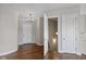 Entryway with hardwood floors, open staircase and white doors at 4212 Stone Lake Dr, Zionsville, IN 46077