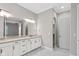 Bathroom with double vanity, granite countertop, and marble floors at 4212 Stone Lake Dr, Zionsville, IN 46077