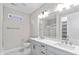 Modern bathroom with double vanity and a large mirror at 4212 Stone Lake Dr, Zionsville, IN 46077