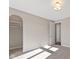Bedroom with large window, walk-in closet, and access to hallway at 4212 Stone Lake Dr, Zionsville, IN 46077