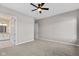 Neutral-toned bedroom with plush carpeting and ceiling fan at 4212 Stone Lake Dr, Zionsville, IN 46077