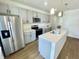 Modern kitchen with stainless steel appliances and a large island at 219 N Temple Ave, Indianapolis, IN 46201