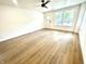 Bright living room with hardwood floors and neutral walls at 221 N Temple Ave, Indianapolis, IN 46201