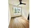 Bright bedroom with wood flooring and two large windows at 221 N Temple Ave, Indianapolis, IN 46201