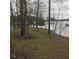 Wooded lakefront lot with gentle slope and access to the water at 3931 N Foxcliff W Dr, Martinsville, IN 46151