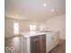 Bright kitchen featuring white cabinets and an island at 6330 Basden Dr, Indianapolis, IN 46221