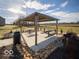 Modern covered picnic pavilion with tables and trash receptacle at 6330 Basden Dr, Indianapolis, IN 46221