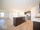 Modern kitchen with stainless steel appliances and an island at 8827 Tortugas Ct, Camby, IN 46113