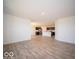 Open concept living area with hardwood-style flooring at 8827 Tortugas Ct, Camby, IN 46113