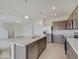 Modern kitchen with stainless steel appliances and an island at 3712 Windstar Ct, Columbus, IN 47203