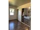 Spacious bedroom with mirrored closet and wood-look flooring at 7303 Shamrock Dr, Indianapolis, IN 46217