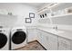 Bright laundry room with washer, dryer, and ample storage at 0 E 239Th St, Noblesville, IN 46060