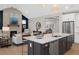 Open concept kitchen with large island and adjacent living room at 0 E 239Th St, Noblesville, IN 46060