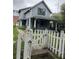 Two-story house with a white picket fence at 726 Dorman St, Indianapolis, IN 46202