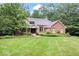 Brick home with large yard and mature trees at 8801 Traders Lndg, Brownsburg, IN 46112